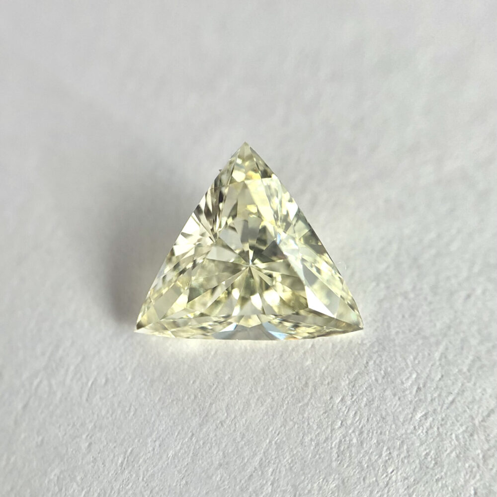 Trillion shape yellow color diamond