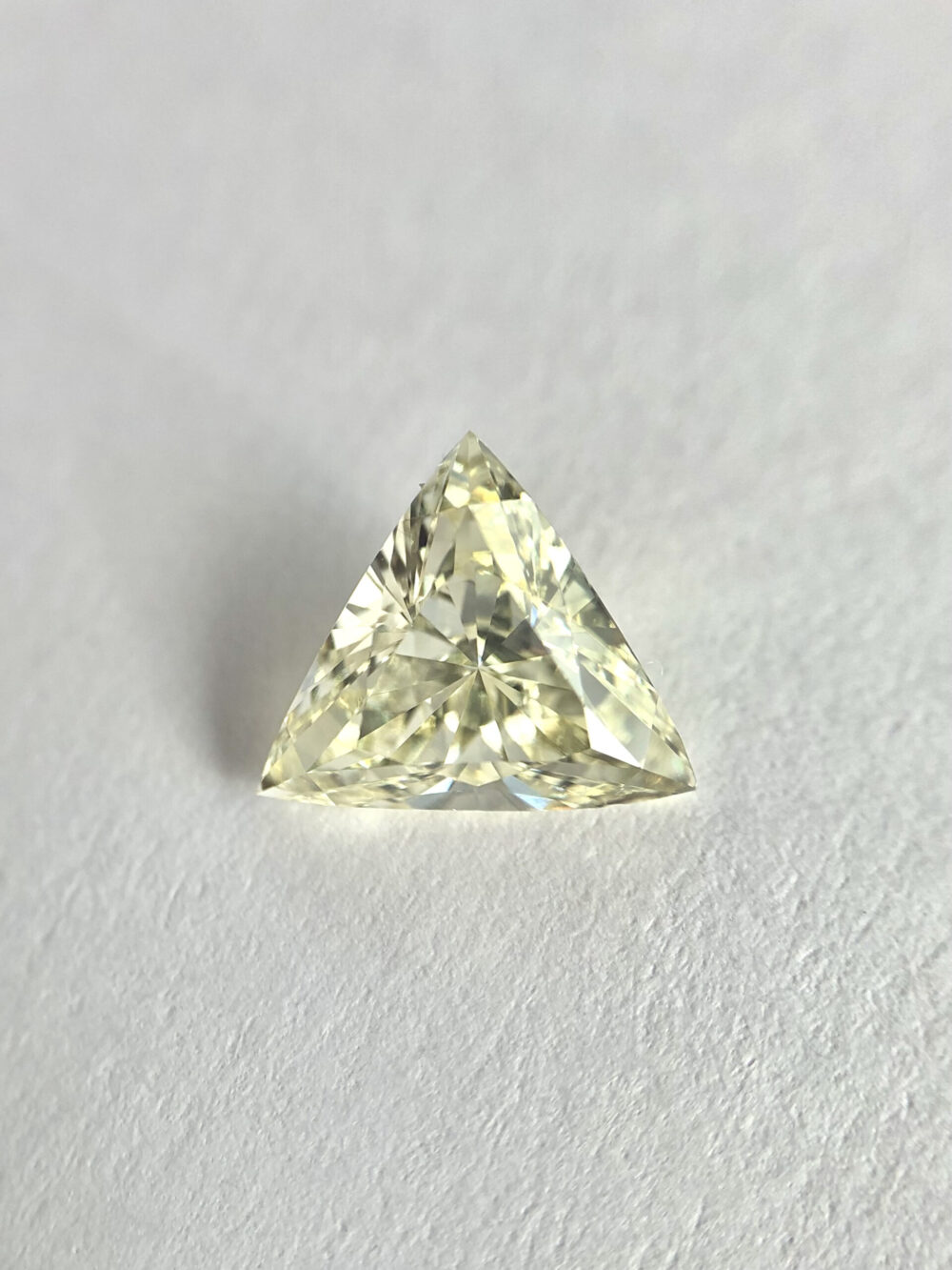 Trillion shape yellow color diamond