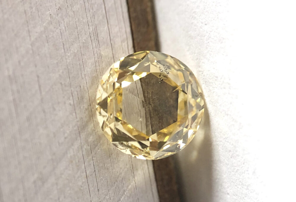 Round shape brownish orange color Rose cut diamond