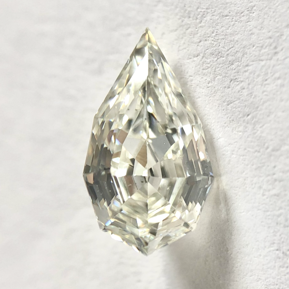 Pear shape J color step cut diamond