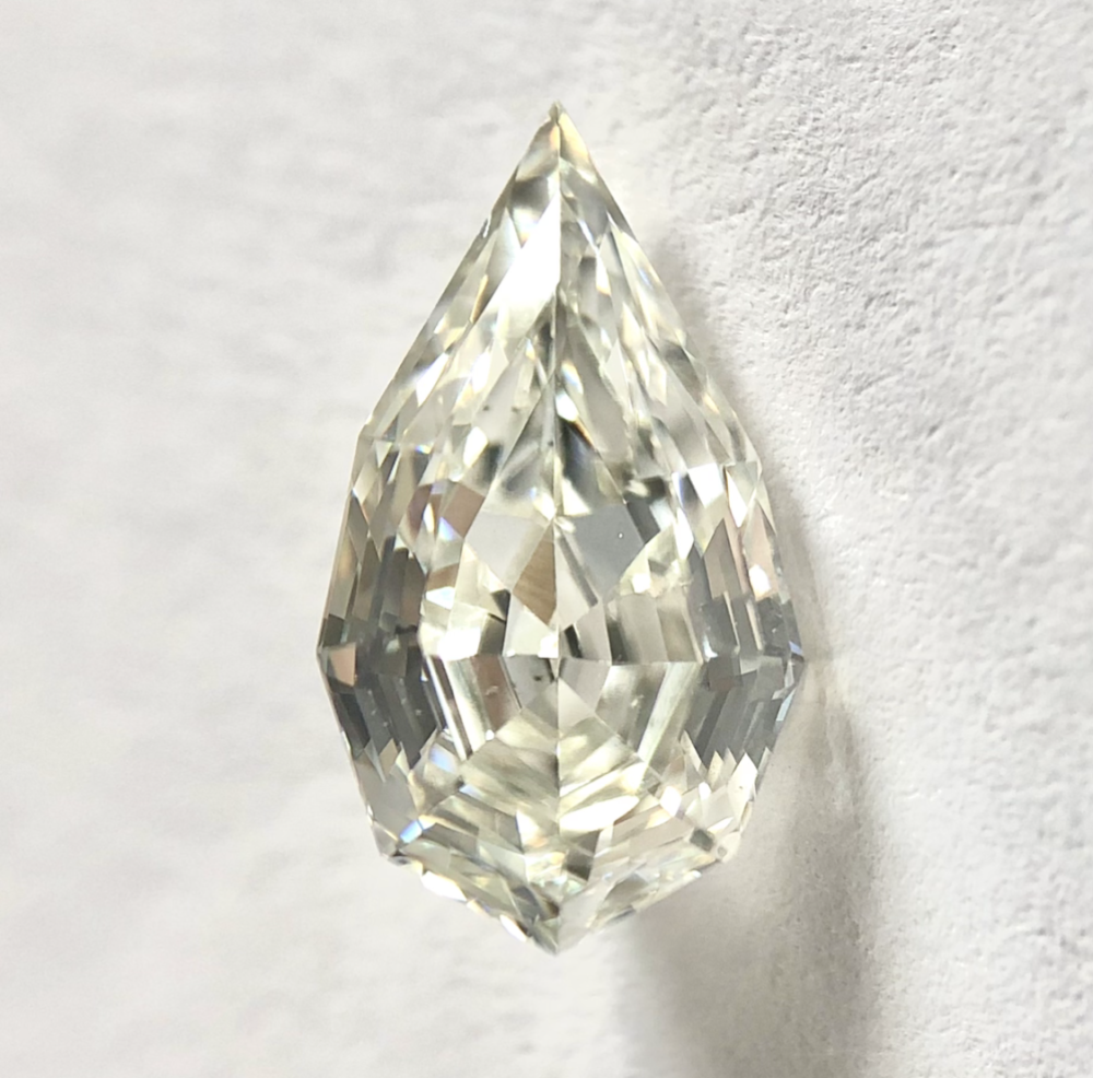 Pear shape J color step cut diamond