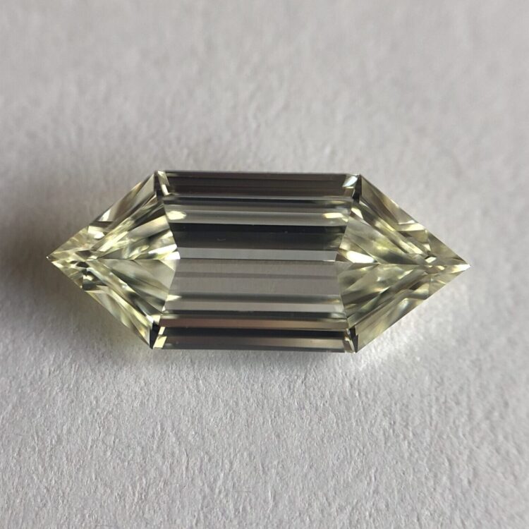 Elongated hexa shape K color step cut diamond