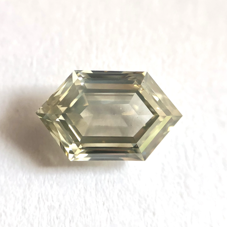 Elongated hexagone shape M color step cut diamond