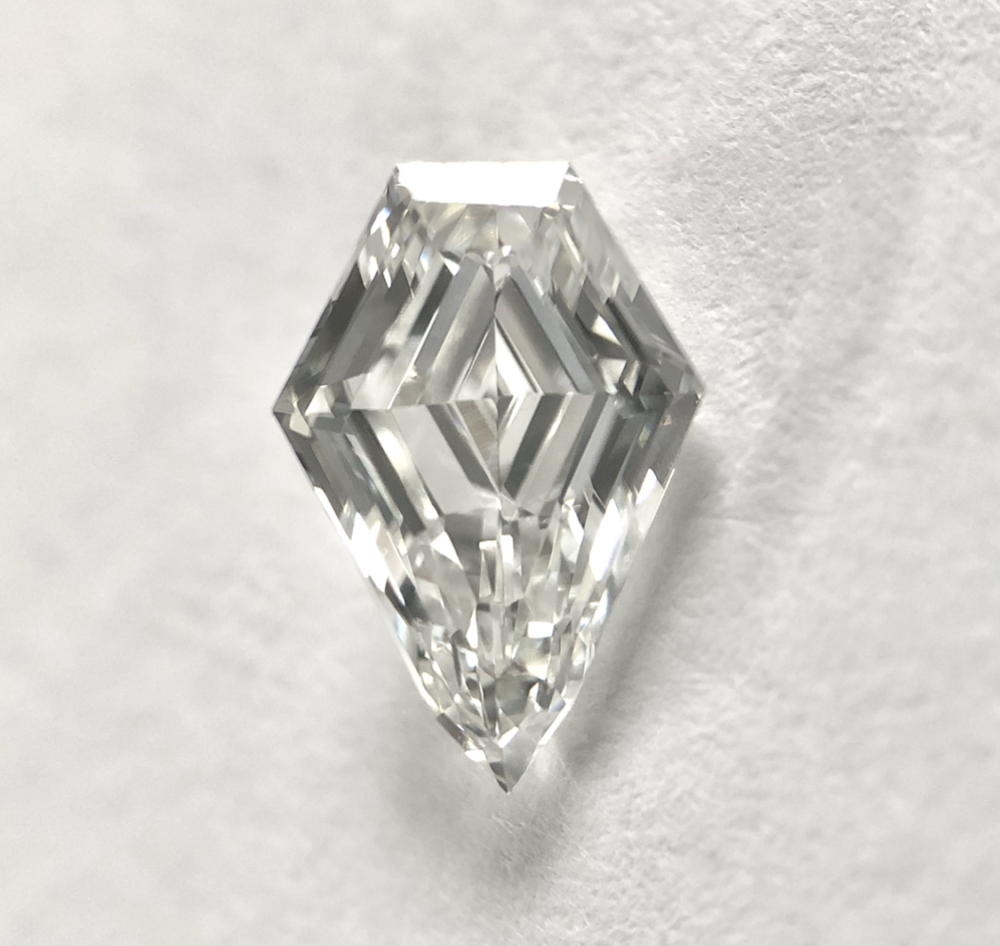 Sheild shape G color step cut diamond