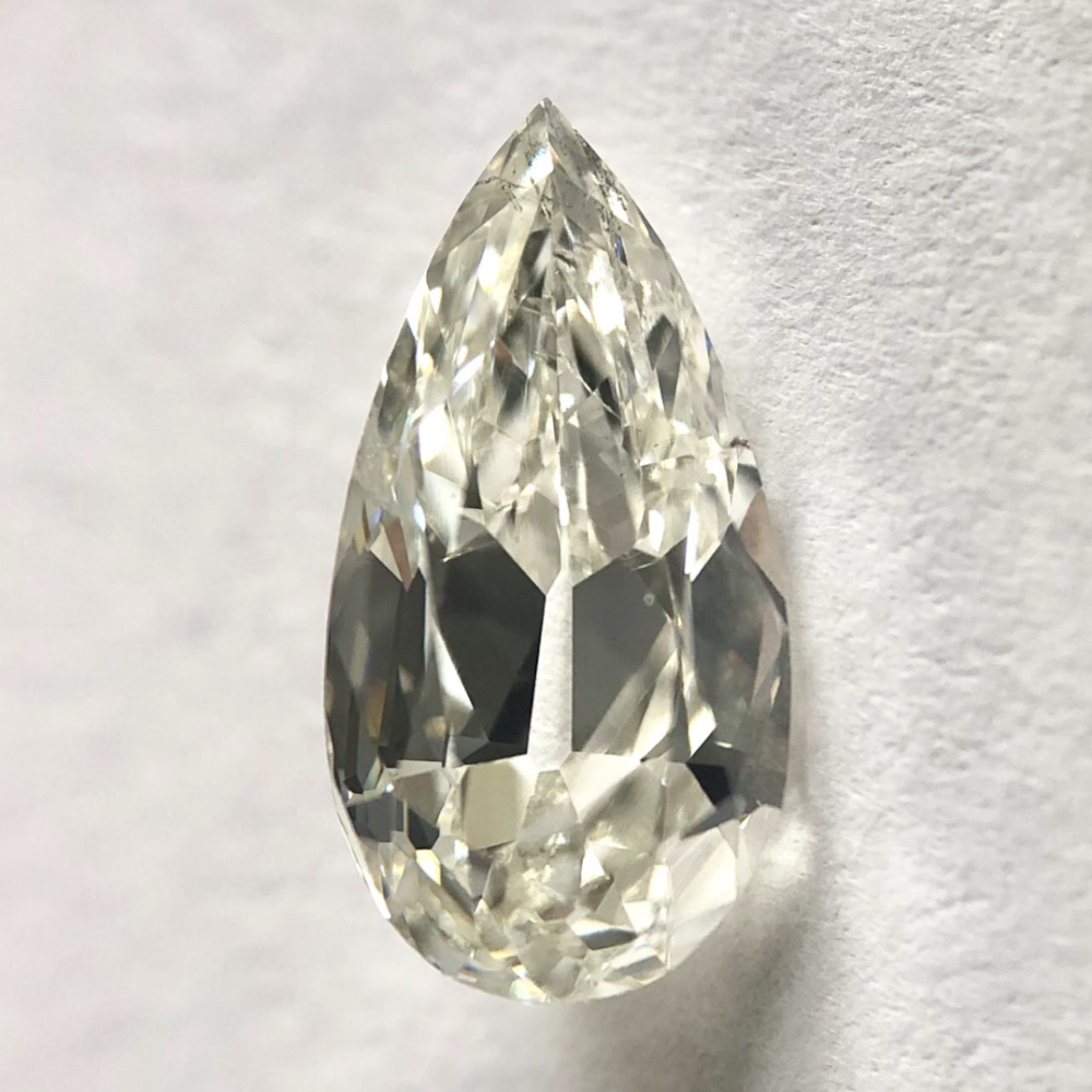 Pear shape H color old mine cut diamond