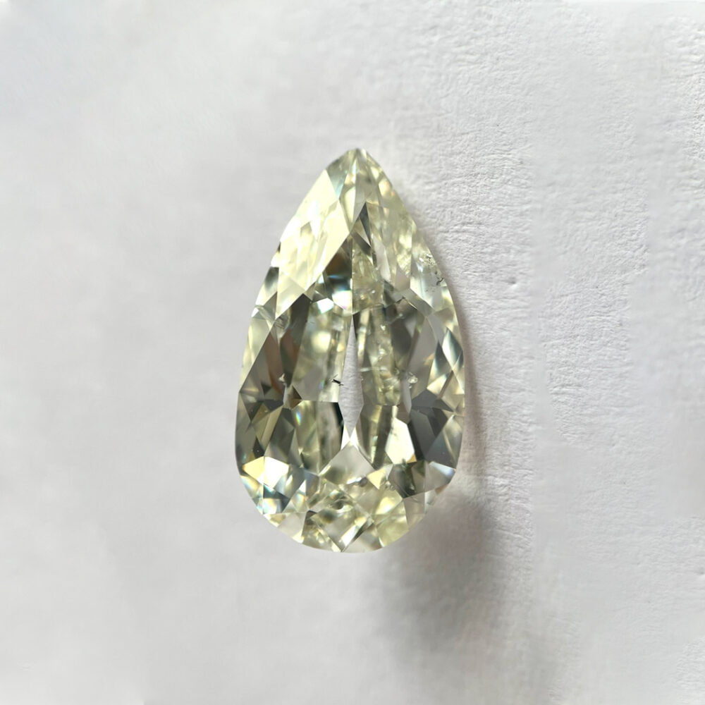 Pear shape K color old mine cut diamond