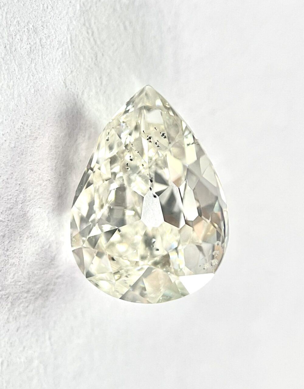 Pear shape K color old mine cut diamond