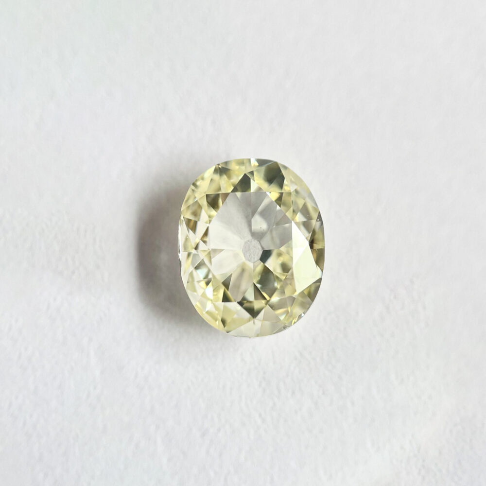 Oval shape N color old miner diamond